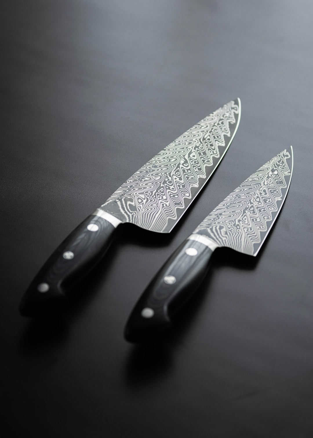 a pair of knives sitting on top of a table